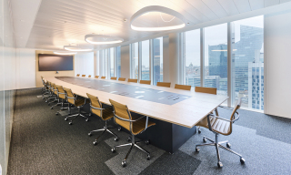 Meeting room with large conference table and audiovisual technology